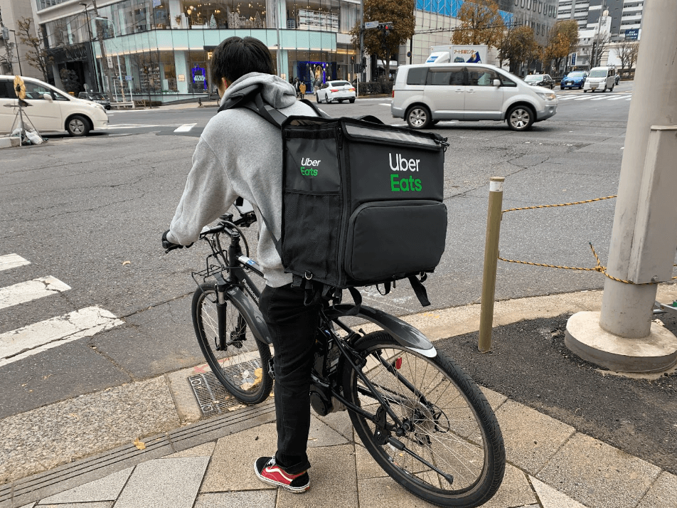 an UberEats delivery partner on a cycle